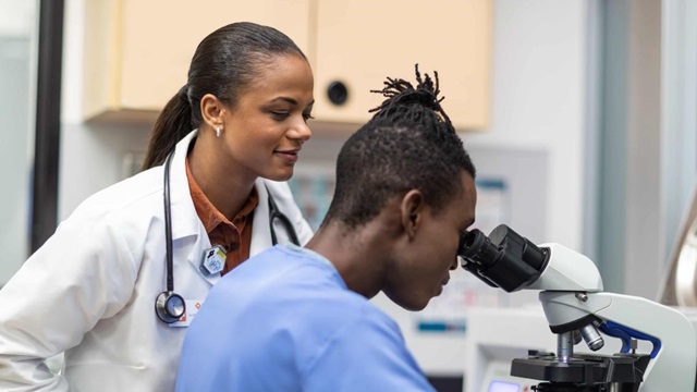 Doctor looking in stethoscope